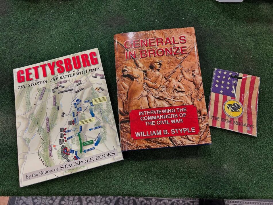 Two books and a challenge coin.