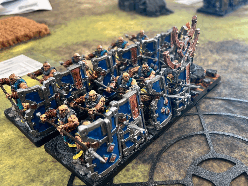 Dweghom Initiates... carrying tower shields in the front rank, and long polearms in the rear rank