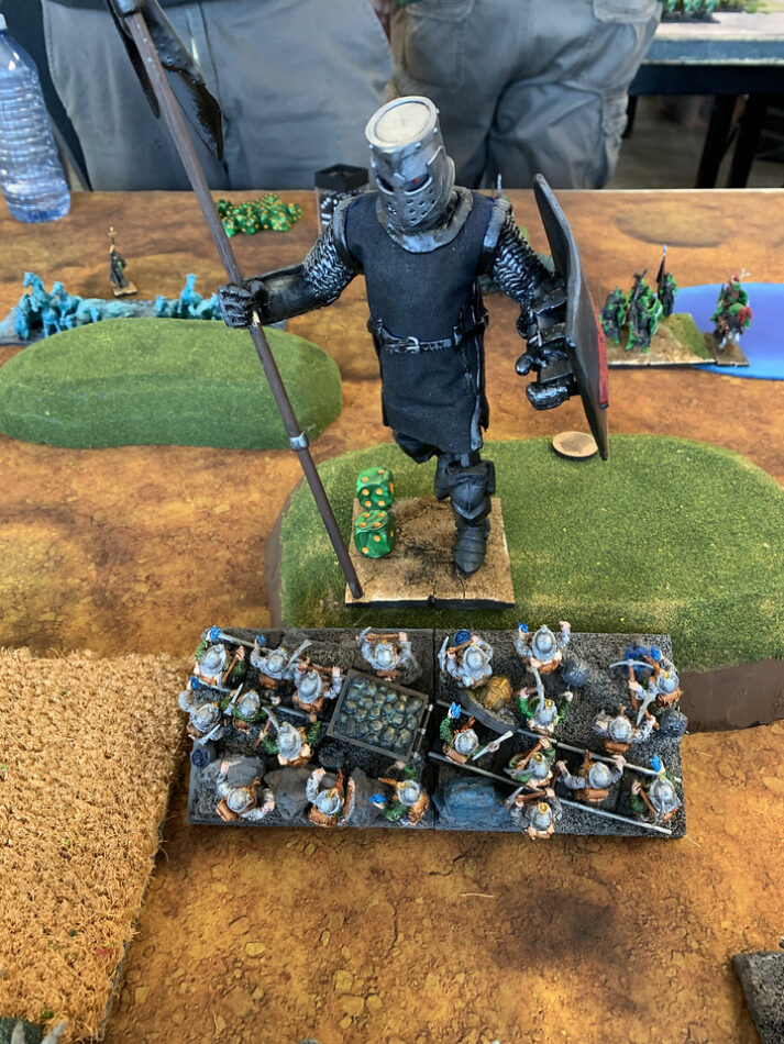 A giant "Black Knight" faces off against Dwarves