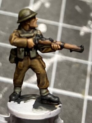 A miniature of a British Rifleman from the Flames of War Early War range.
